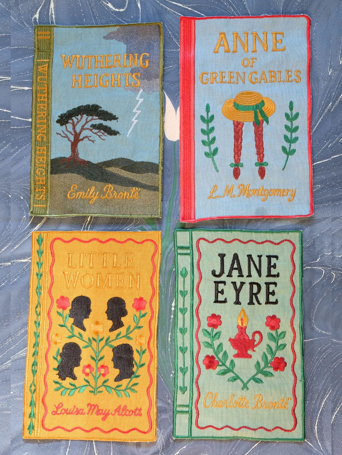 Literary Heroines Embroidered Linen-Blend Cocktail Napkins — four embroidered napkins showing the individual literary titles; Inner Child