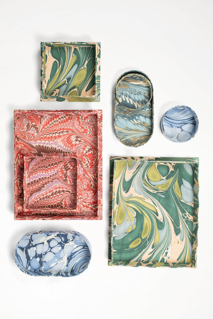Nila Feathers Marbled Round and Oval Desk Trays — Nila trays displayed with separately sold patterned trays; Inner Child
