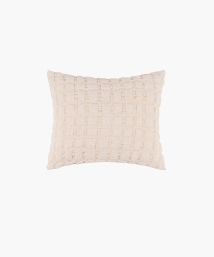 Rectangular cream sham with a puffed grid texture and stitched detail, styled against a white backdrop. | Wildwood Home Co.