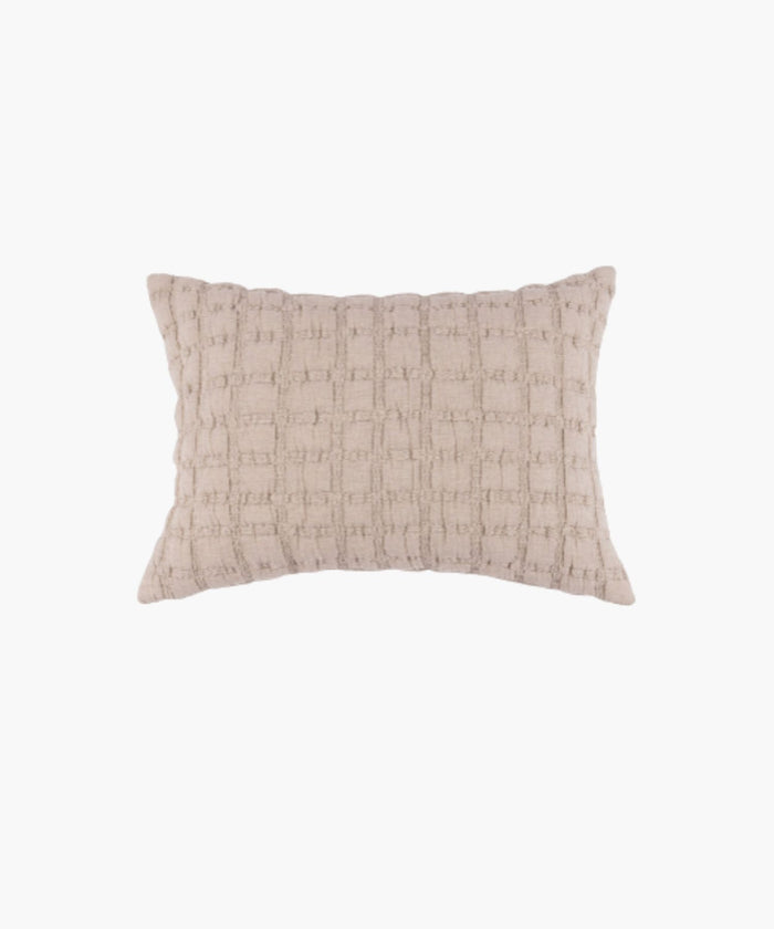 Rectangular beige sham with a puffed grid texture and stitched detail, styled against a white backdrop.