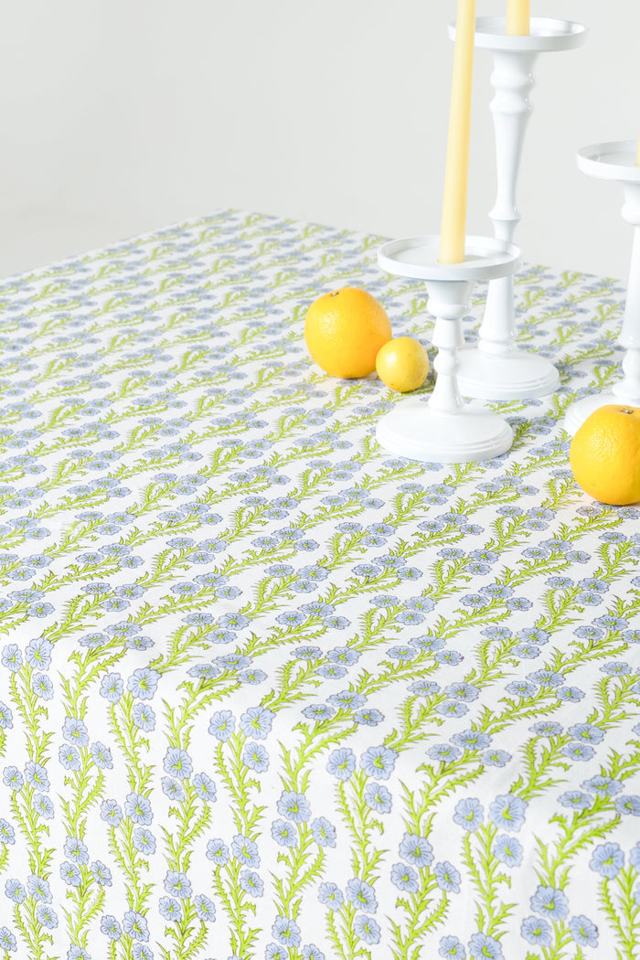Forget-Me-Not Scalloped Blockprint Cotton Tablecloth — close view of the floral stripes beneath separate candle holders; Inner Child