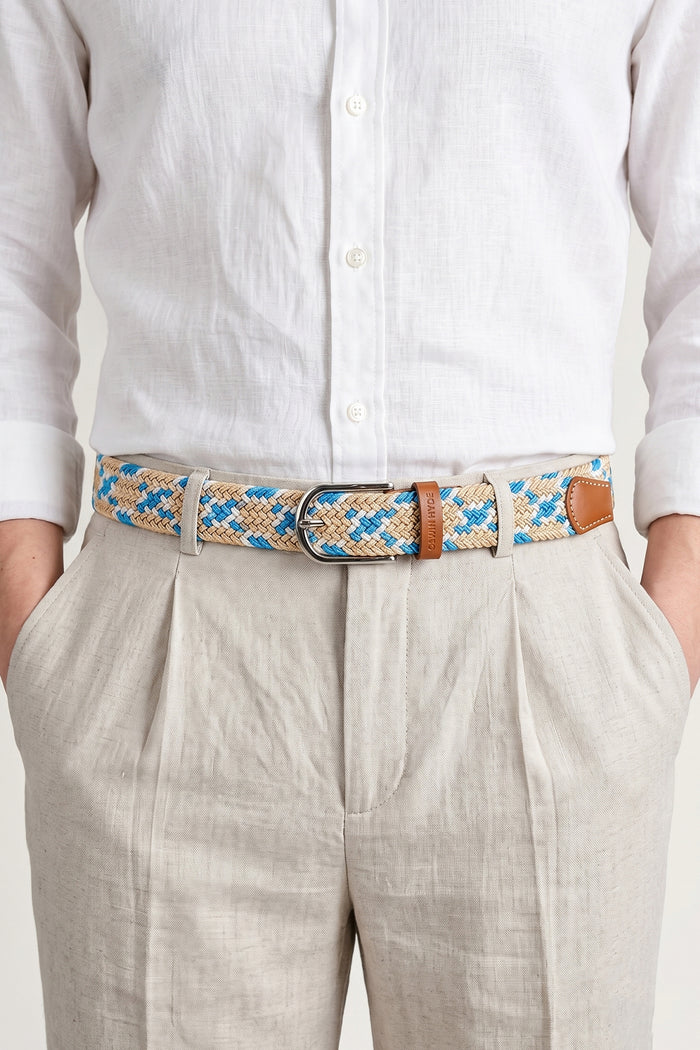 Man wearing Oswin Hyde Guy Beige belt - Braided elastic in neutral tones for smart-casual wear