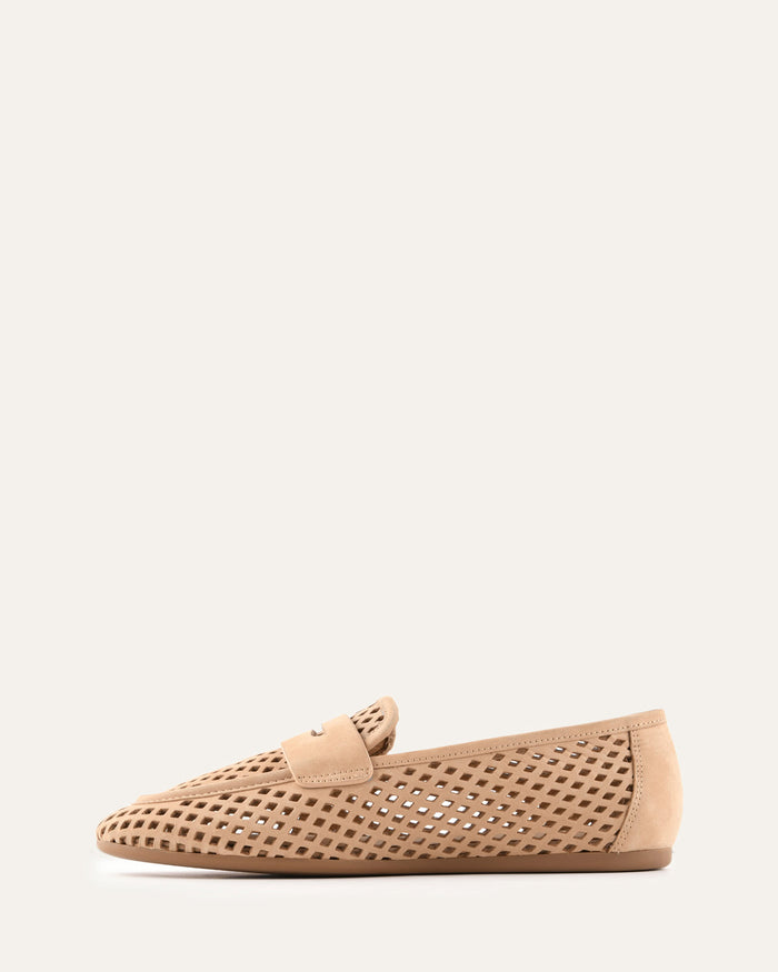 Beige loafer shoe with perforated design on a white background