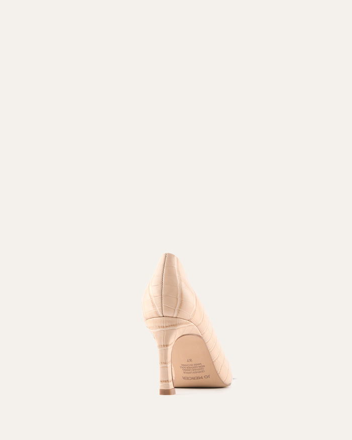 Beige high-heeled shoe on a white background