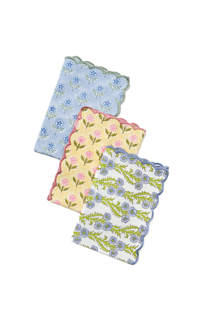 Mona Blue Scalloped Cotton Napkins — Mona Blue napkin beside separately sold napkins in other patterns; Inner Child