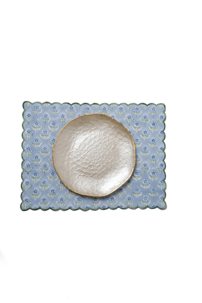 Mona Blue Scalloped Cotton Placemat — Mona Blue mat beneath a separate textured plate; Inner Child