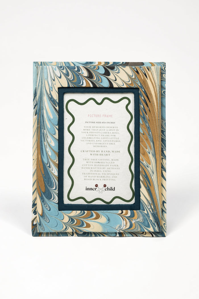 Nila Feathers Marbled Picture Frame for 4 x 6 Photos — front view of the marbled frame with sample insert; Inner Child