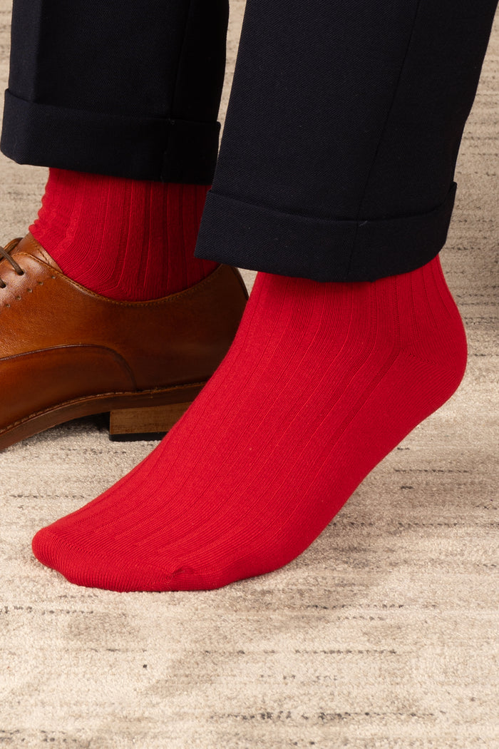 Oswin Hyde Groovy Six premium socks in bold reds, blues, and pinks, packaged in a sleek box for stylish gifting