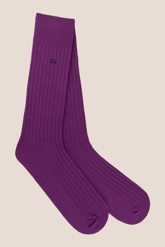 Oswin Hyde Groovy Six premium socks in bold reds, blues, and pinks, packaged in a sleek box for stylish gifting