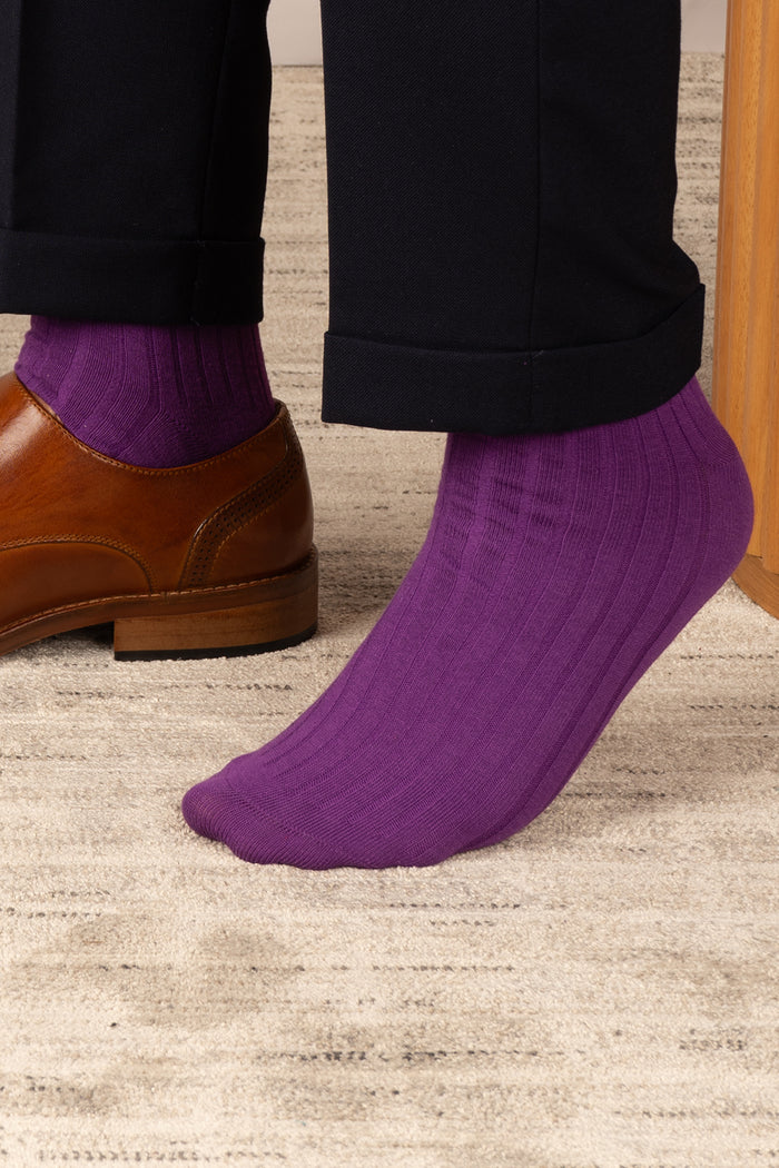 Oswin Hyde Groovy Six premium socks in bold reds, blues, and pinks, packaged in a sleek box for stylish gifting