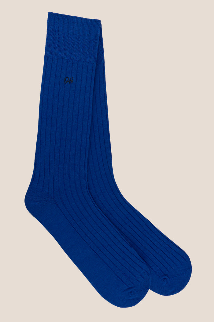 Oswin Hyde Groovy Six premium socks in bold reds, blues, and pinks, packaged in a sleek box for stylish gifting