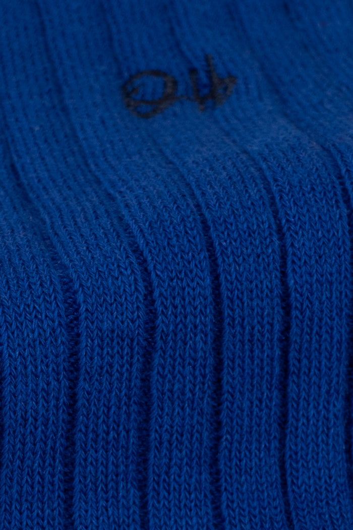 Oswin Hyde Groovy Six premium socks in bold reds, blues, and pinks, packaged in a sleek box for stylish gifting