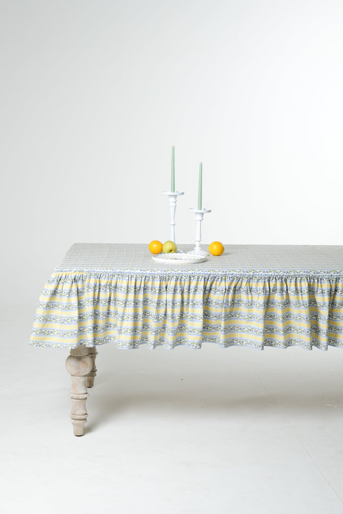 Provence Butter Yellow Ruffled Cotton Tablecloth — full table showing the cloth drape and border; Inner Child