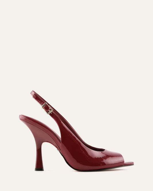 Red high-heeled shoes on a white background