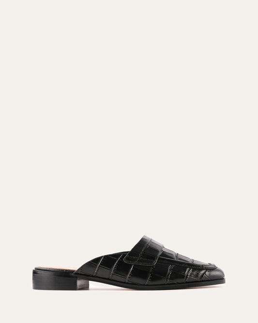 Black crocodile-patterned loafer on a white background