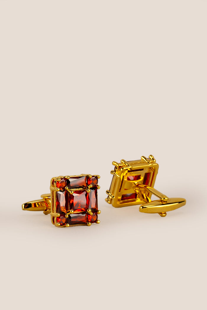 Close‑up of Zirc Ruby men’s cufflinks with deep ruby gemstones set in intricate metalwork for formal sophistication and luxury.