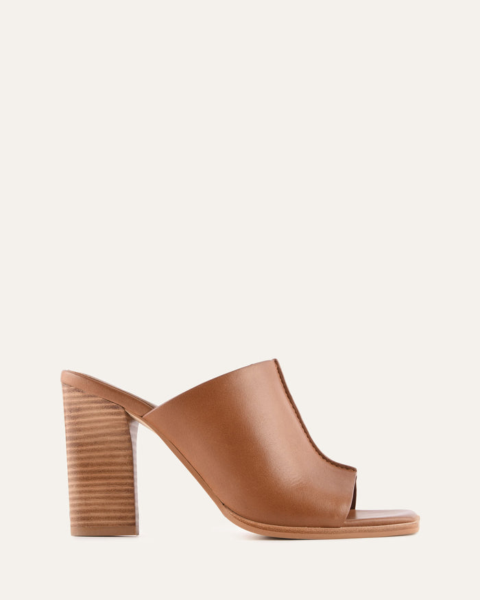 Brown open-toe high-heeled shoe on a white background