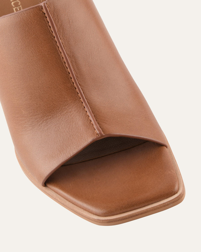 Close-up of a brown sandal on a light gray background